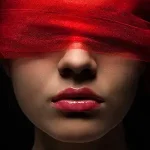 Woman's face with a red blindfold